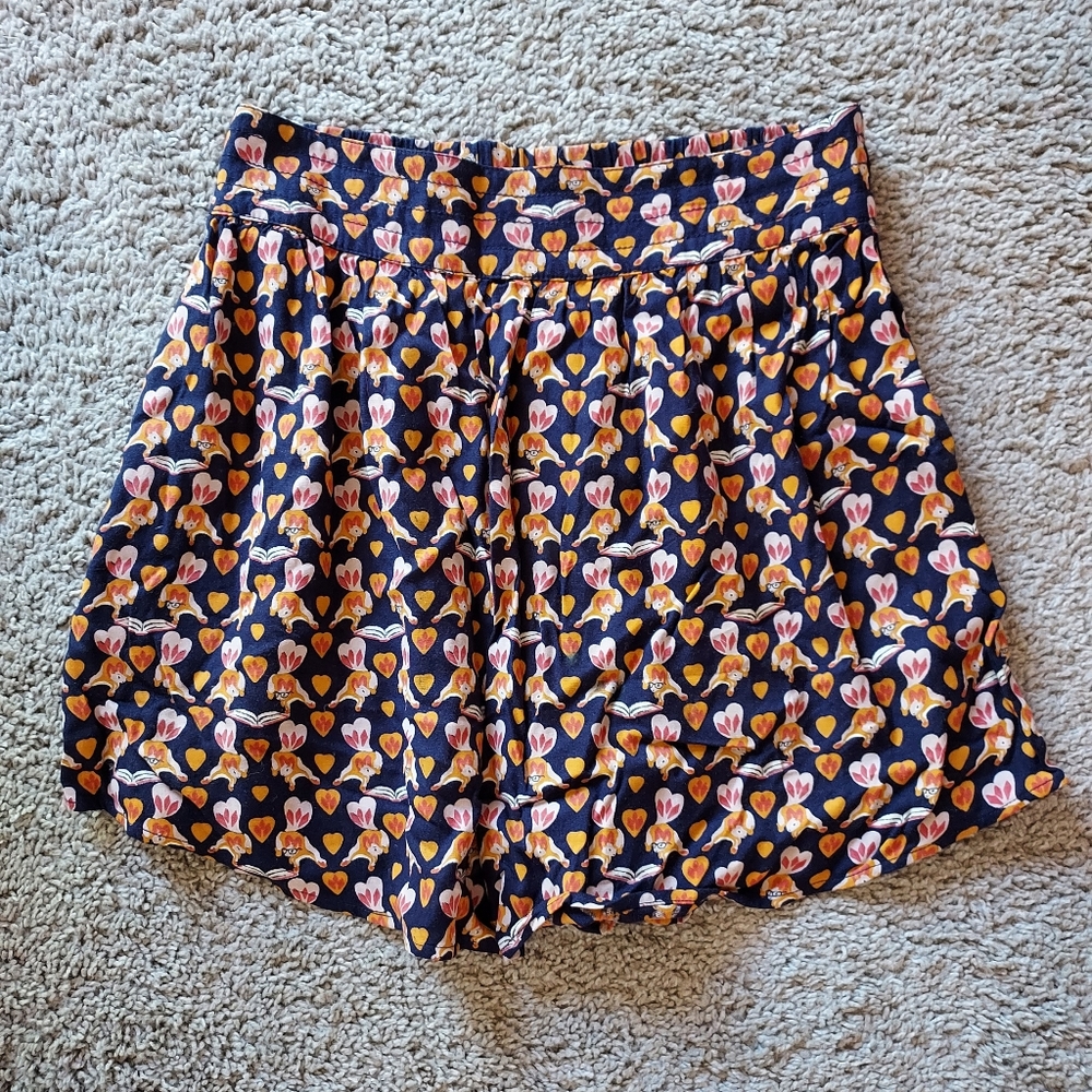 Urban Outfitters foxes reading books print mini skirt